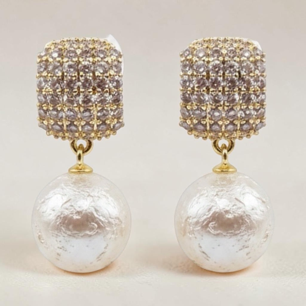 Riri Bespoke Jewelry gold-tone drop earrings with textured square crystal studs and large lustrous faux pearls.