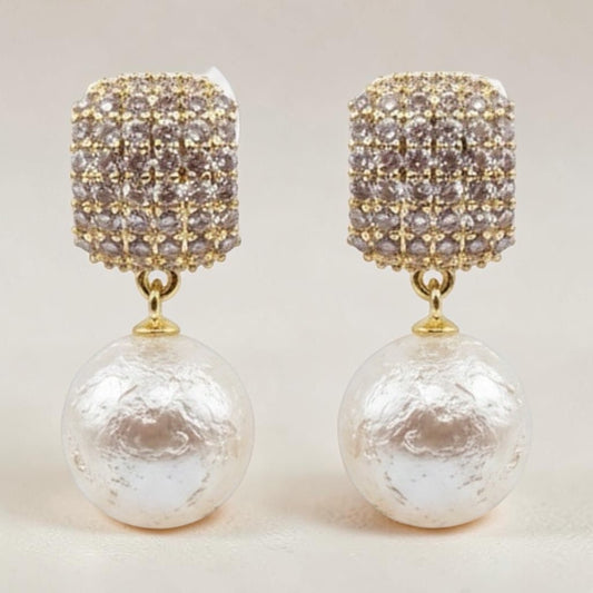 Riri Bespoke Jewelry gold-tone drop earrings with textured square crystal studs and large lustrous faux pearls.