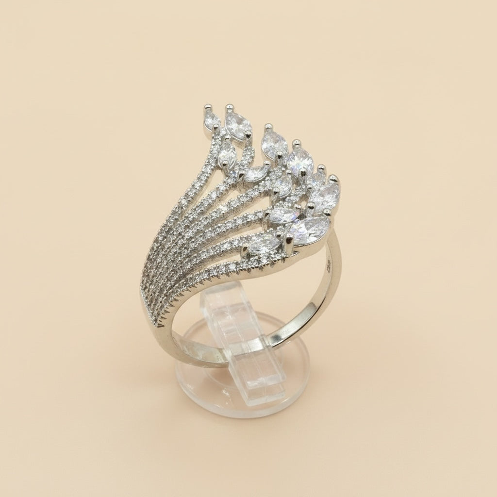 Riri Bespoke Jewelry silver-tone statement ring with a fan-shaped design, pavé stones, and marquise-cut crystals.