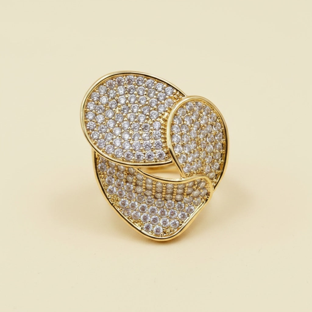 Riri Bespoke Jewelry gold-tone statement ring with layered floral silhouette and pavé-set clear crystals