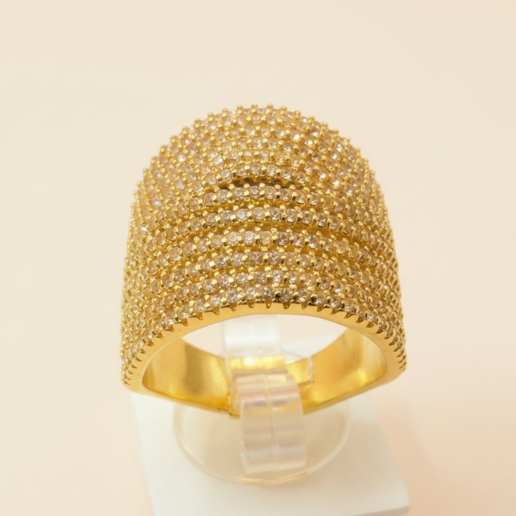Riri Bespoke Jewelry gold-tone multi-row statement ring encrusted with shimmering cubic zirconia stones.