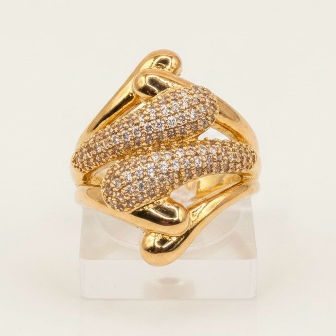 Riri Bespoke Jewelry gold-tone sculptural statement ring with pavé-set crystals in a fluid, modern design.