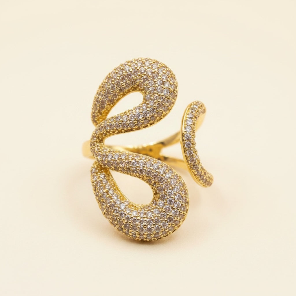 Riri Bespoke Jewelry gold-tone statement ring with an organic open-work silhouette and shimmering pavé-set crystals.